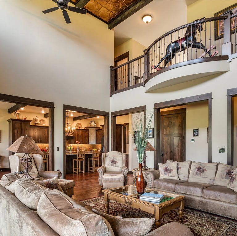 Furnished living room in custom luxury home with custom wood rails and trim in MT