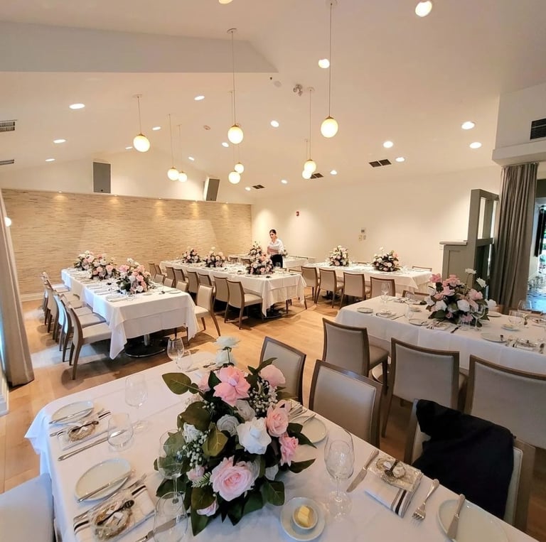Restaurant set up with floral centerpieces