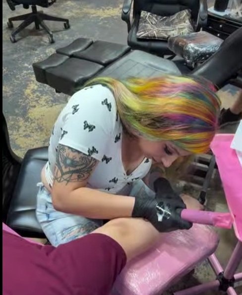 a woman getting tattoo by talented artist that can customize any vision of art for someone