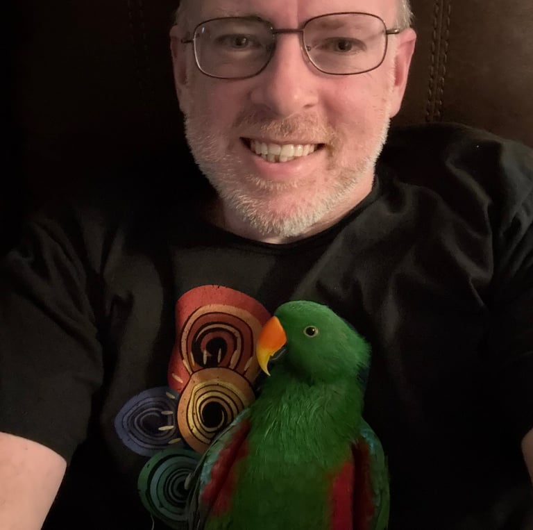 Image of Jeremiah with his parrot named Perrin.