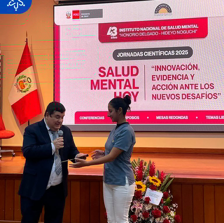 a man and woman standing in front of a screen