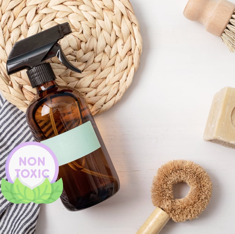 a bottle of cleaners and a brush brush