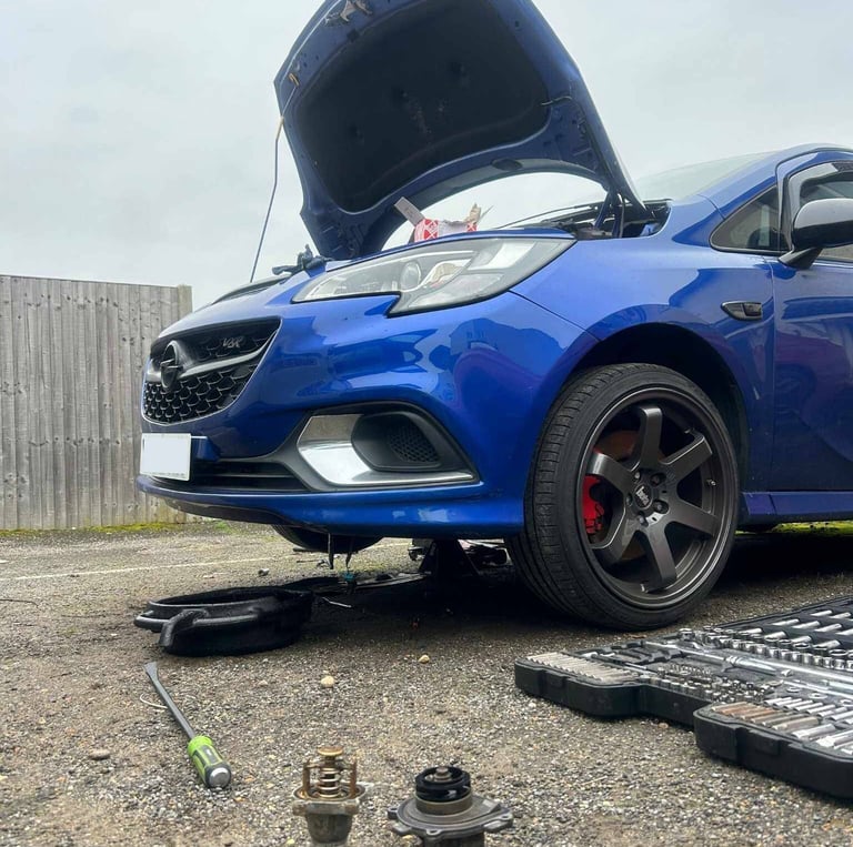 broken down car getting alternator replaced