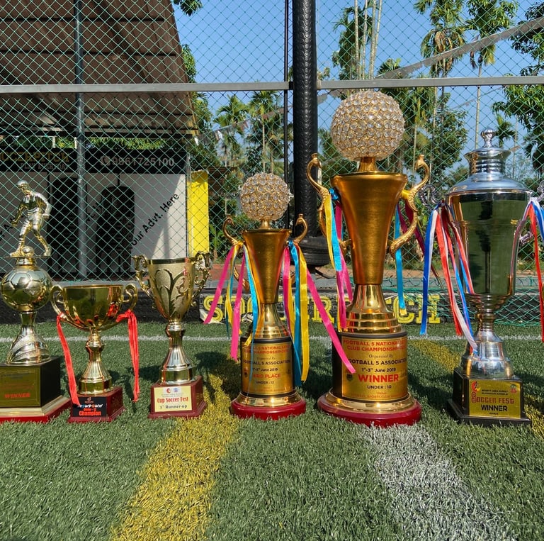 trophies in the football turf background in Ernakulam