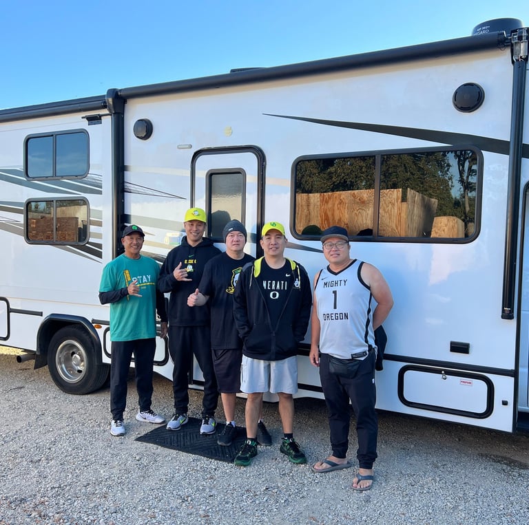 photo of some friends from college in front of a rental motorhome about to start their road trip