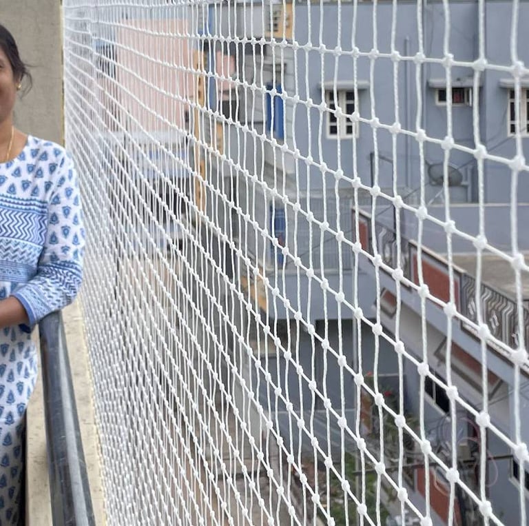 HAPPY CUSTOMER IN ANDHERI WEST BY ARJILLI SAFETY NETS INSTALLING APARTMENT PIGEON NETS