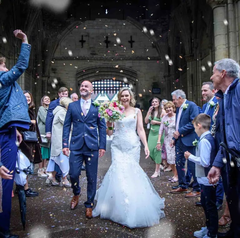 bride and groom having their confetti moment