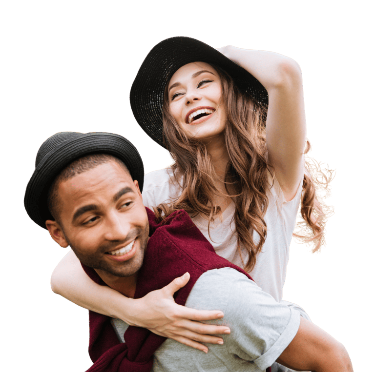 Man carrying woman on his back smiling