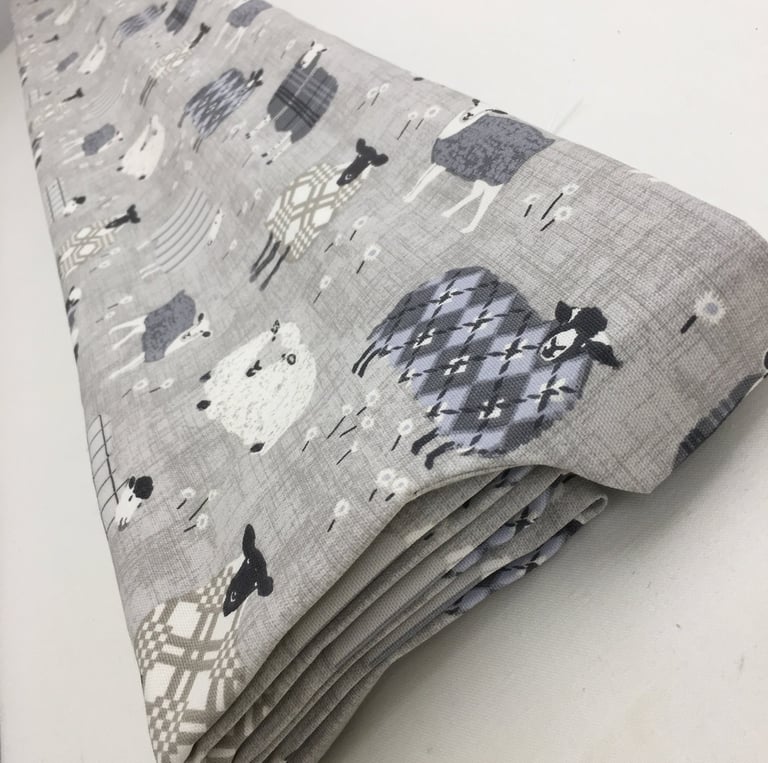 A roman blind with side tab to hide the headrail