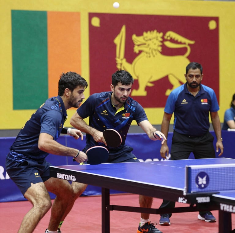 A vibrant group of Sri Lankan table tennis players and coaches sharing a lively moment on the court, reflecting the spirit of unity and passion for the sport.