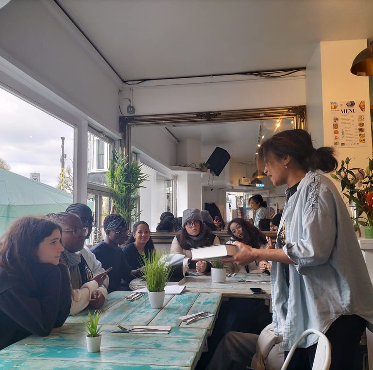At the Portobello Shack, a woman giving talk about Notting Hill Carnival