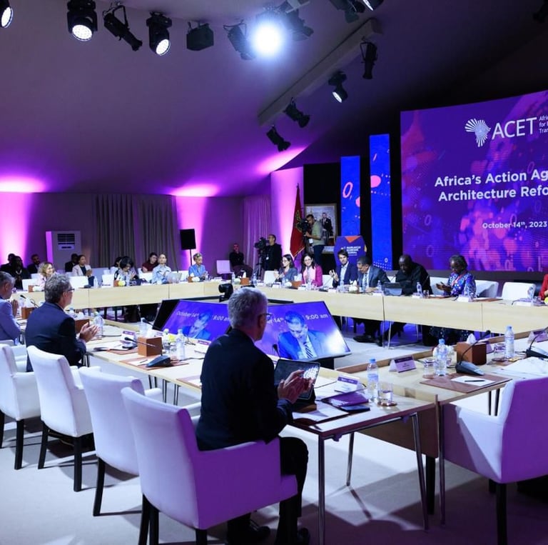 a conference room with a large screen displaying a presentation
