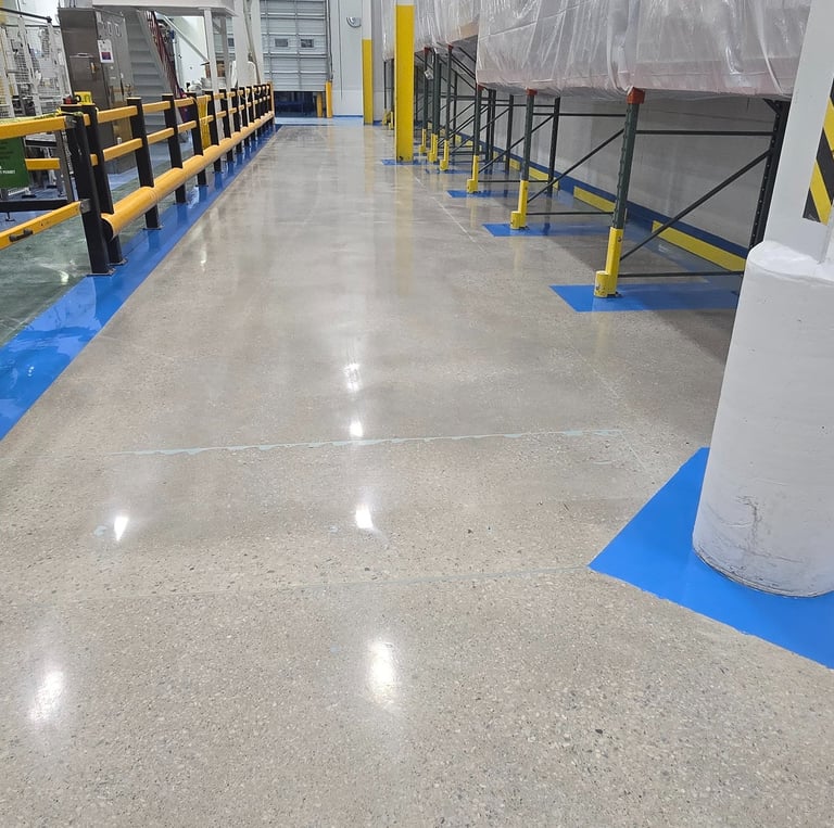 Industrial epoxy flooring and concrete polishing installation in a high production facility