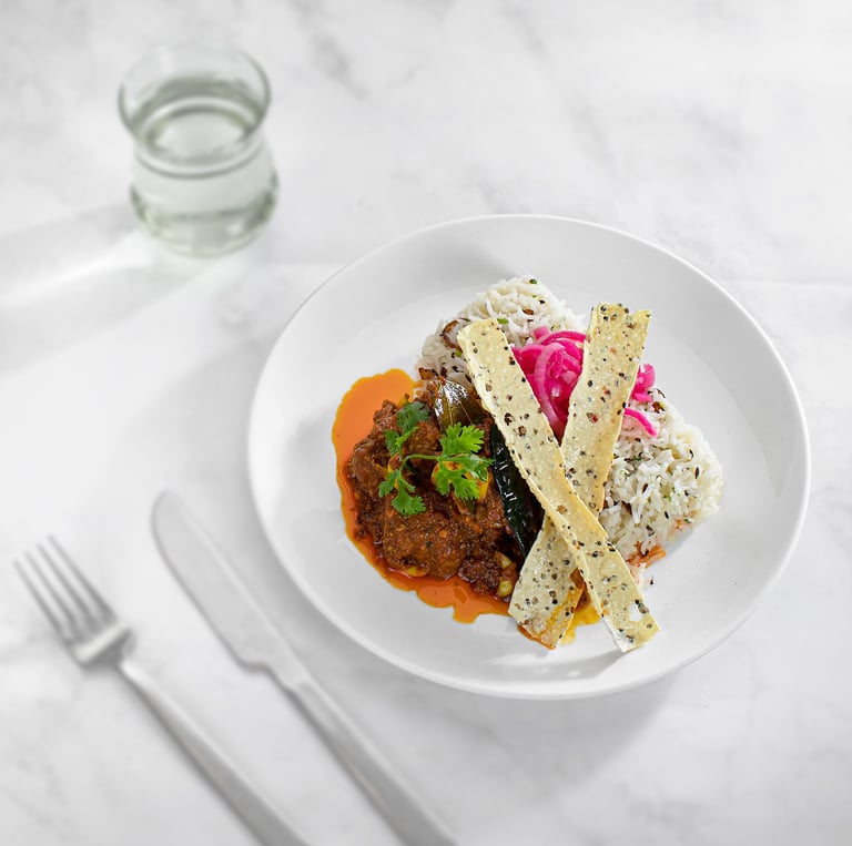 a plate of food with a fork and knife on a table