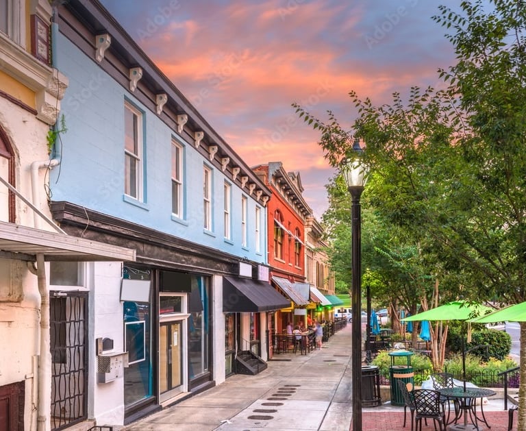 Store fronts in part of Athens, GA with a beautiful sunset in the back ground