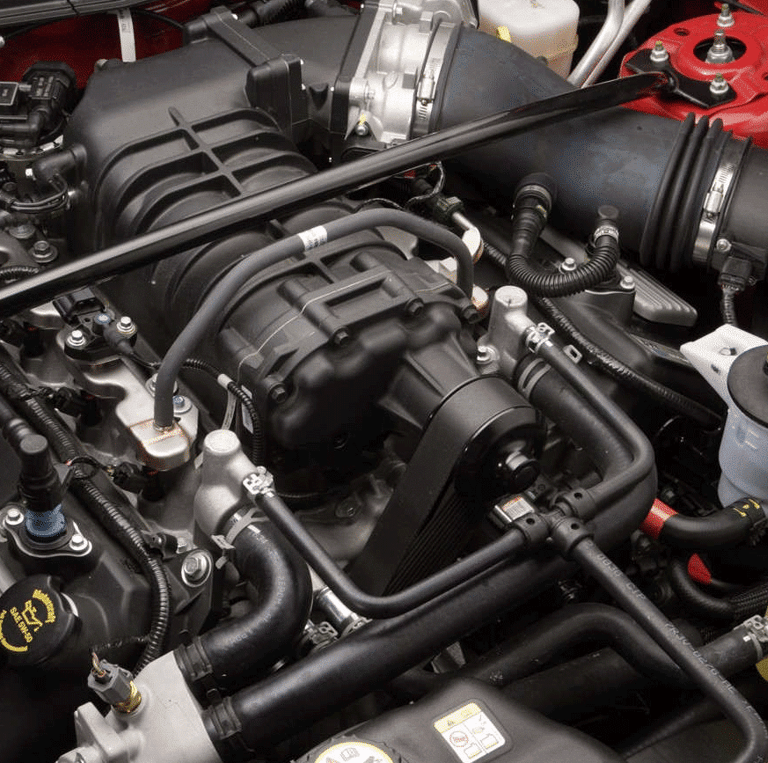 Qualified mobile mechanic performing car diagnostics with state-of-the-art equipment