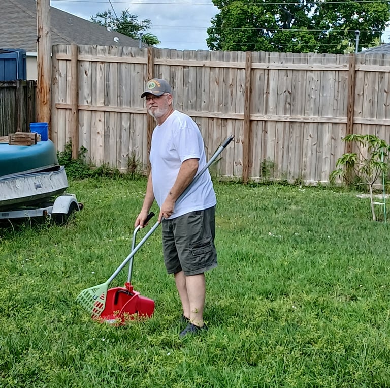 Robert working on removing pet waste from customers yard
