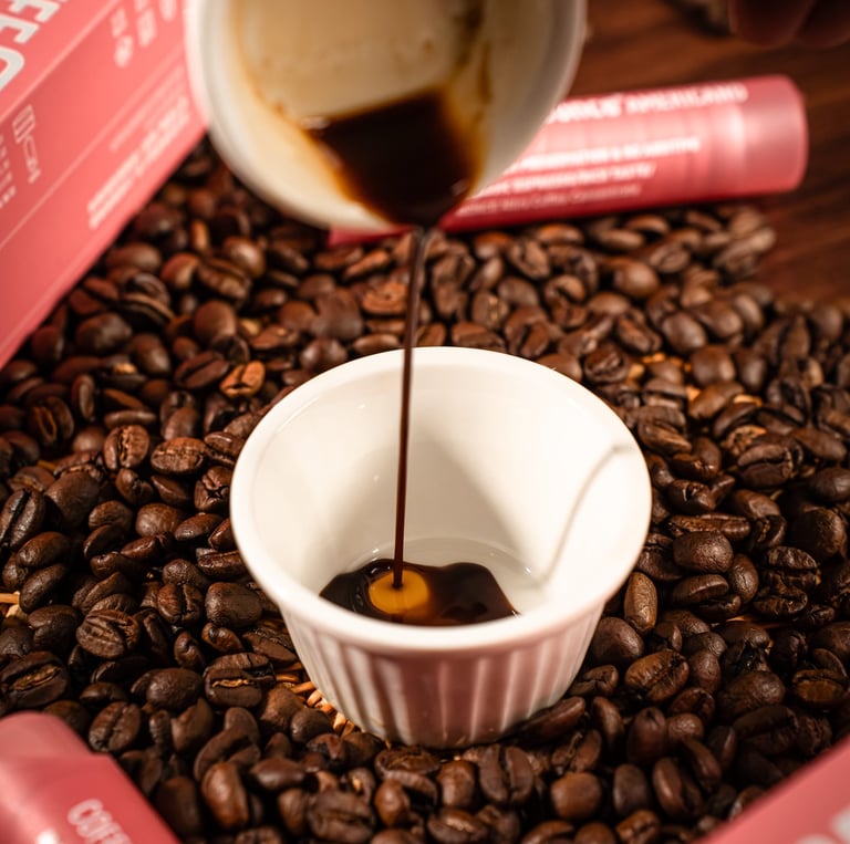 a cup of coffee is being poured with coffee beans