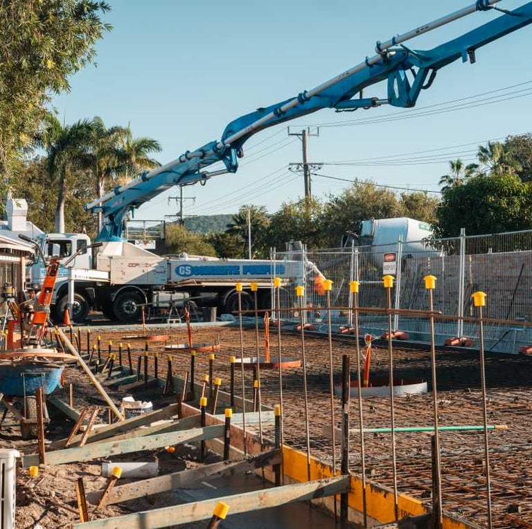 a crane lifts a crane to the top of a building