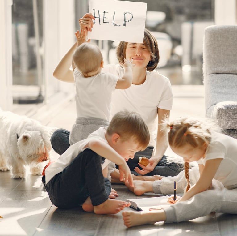 a woman and two children sitting on the floor