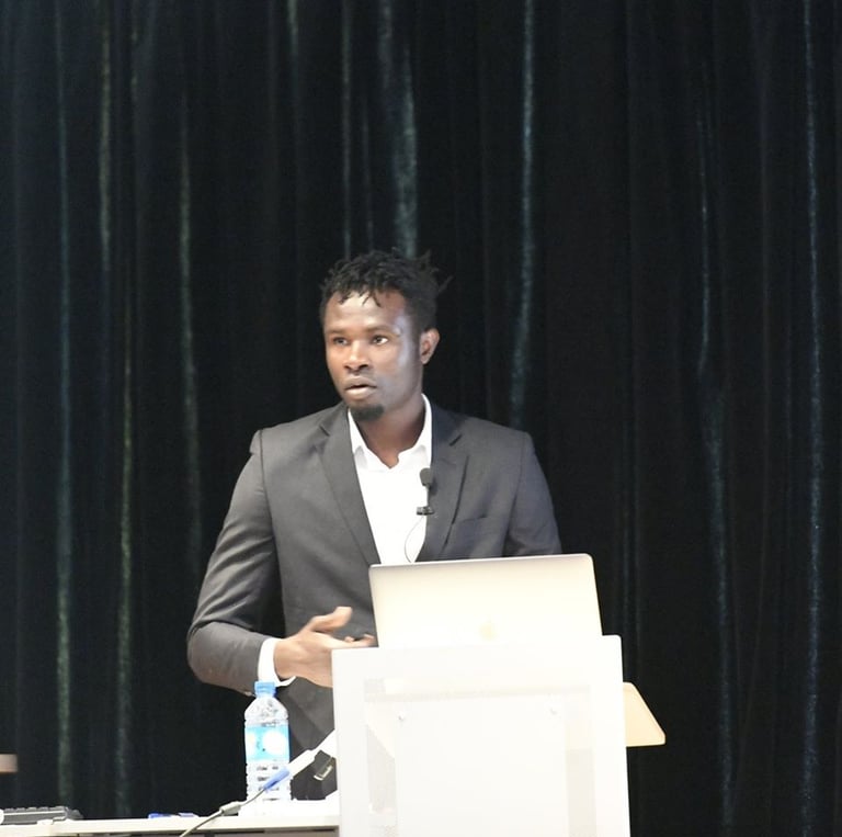 a man in a suit and tie is standing at a podium