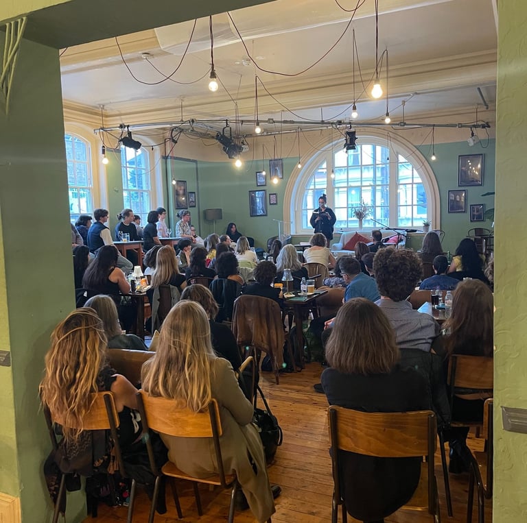 Rachel Long reading poetry at the Battersea Arts Centre during an event hosted by The Writing School