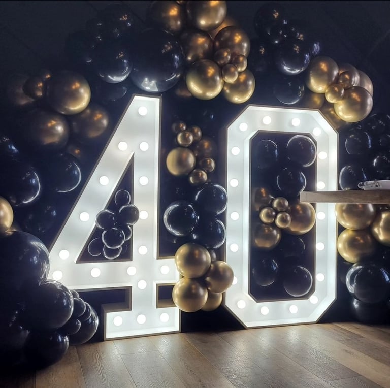 40th marquee and gold and black balloon garland