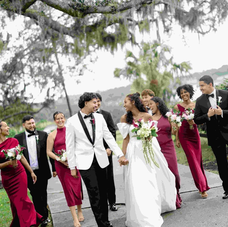 couple at lakeview gardens with bridesmaids in burgundy