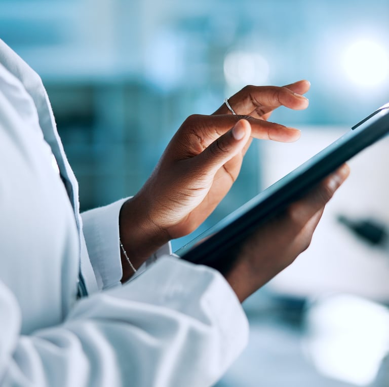 Close-up of a doctor using billing app on ipad