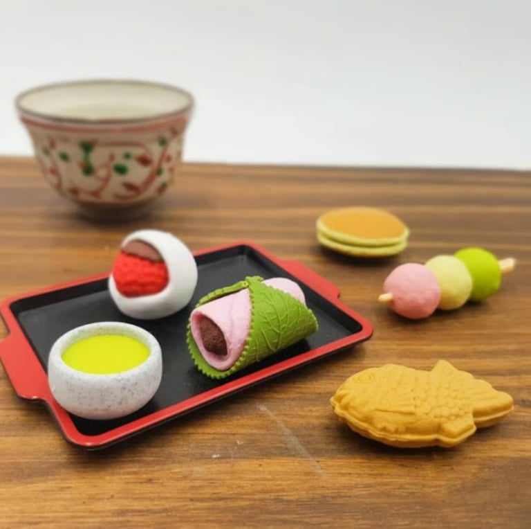 Miniature Japanese wagashi sweets erasers including dango, taiyaki, and mochi 