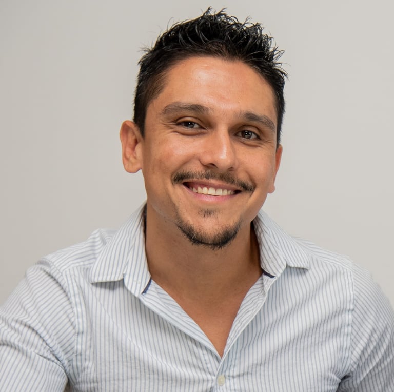 a male translator with a beard and a mustache on his face
