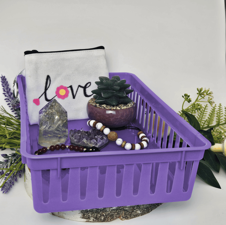 a rectangular purple basket with crystals, bracelets, and a canvas pouch.