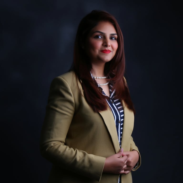 Zaira @ Exxaura in a yellow blazer and a black and white shirt