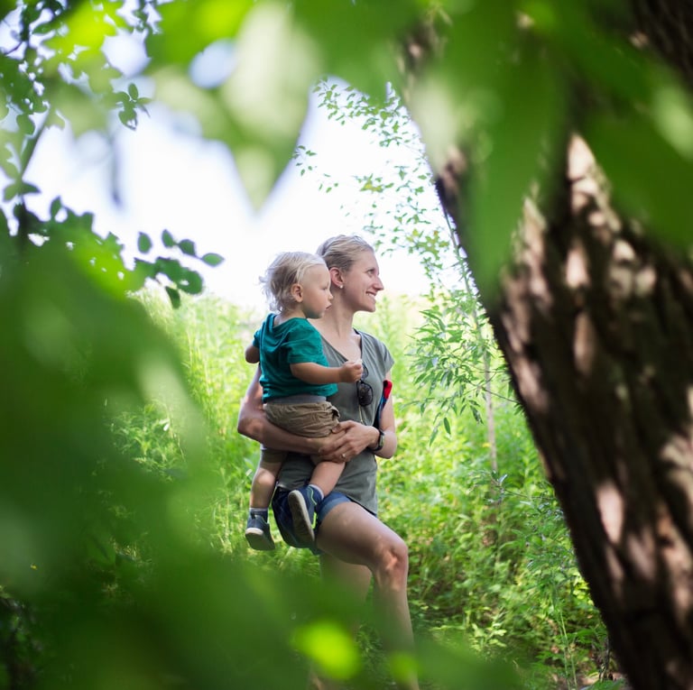 Kara holding child in nature which is beneficial for your health