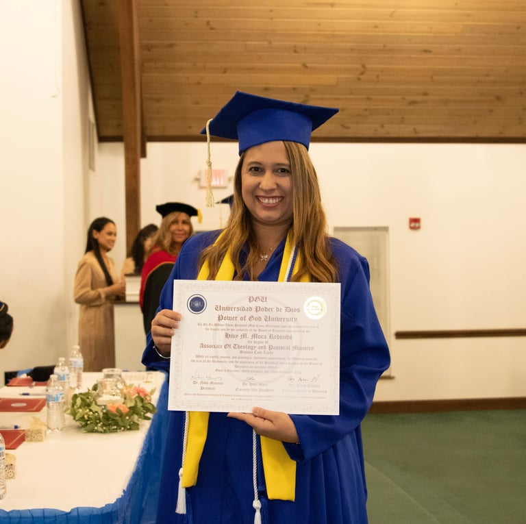 a woman in a graduation gown holding a diploma certificate
