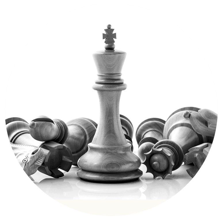 A wooden king chess piece standing tall amidst fallen opponent pieces representing strategic victory.