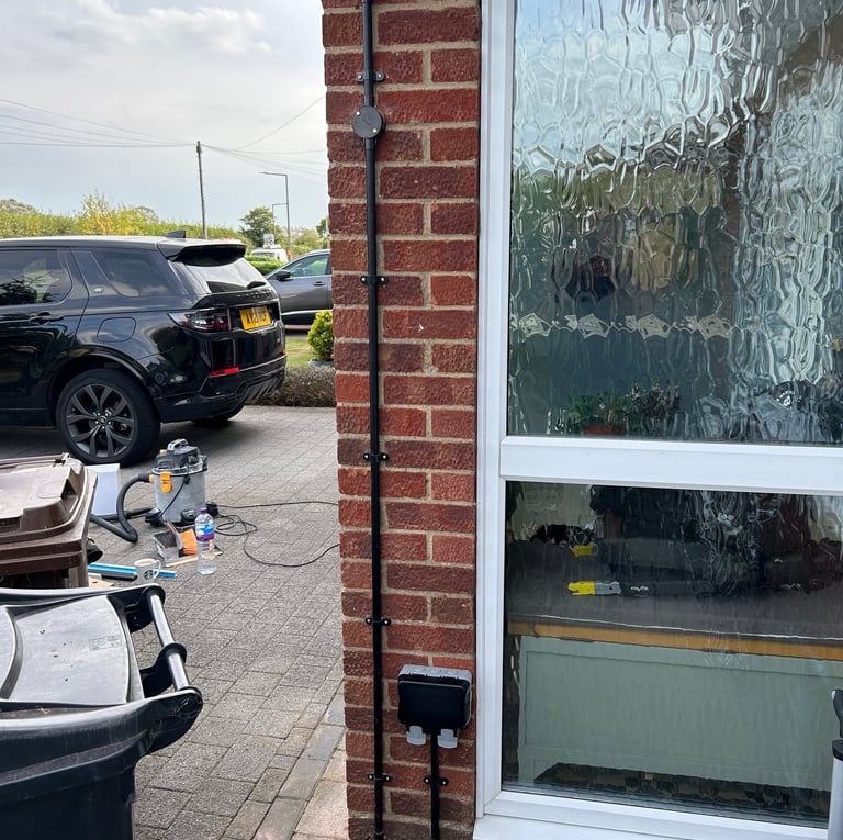 Outside double socket, black plastic conduit, electrical installation uk