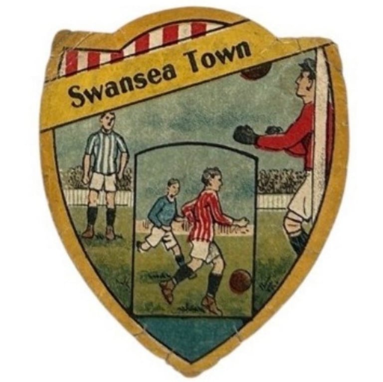 Vintage Swansea Town football crest featuring players in action on a shield-shaped badge.