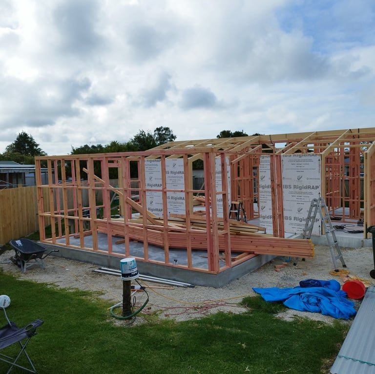 a architect house being built into a house from plans from a draftsman