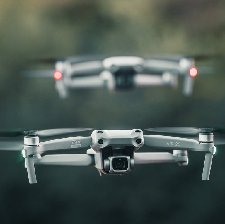 two macic air 2s drones in flight