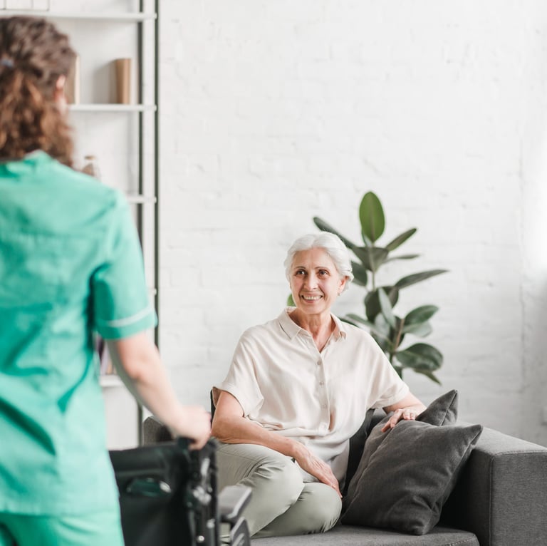 a caregiver and a senior woman in a living room