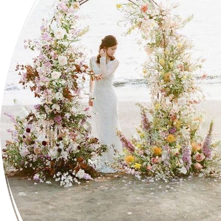 Beach wedding ceremony setup with floral arch and elegant decor in Bodrum