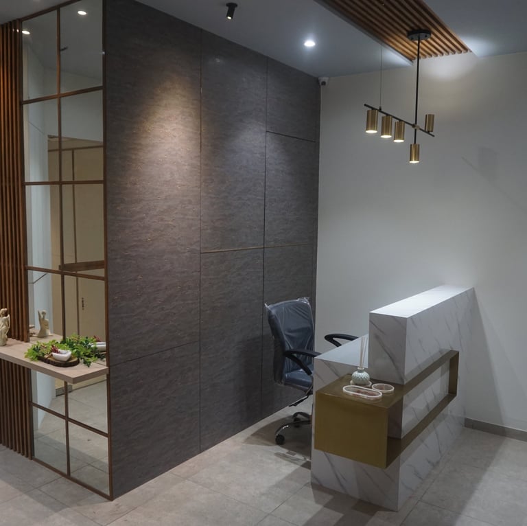 Reception desk design with hanging lights and hidden door with mirror shelf