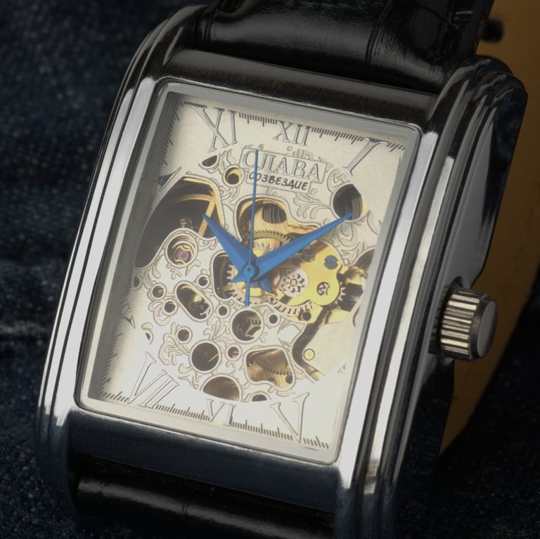 Close up product photograph of a watch on a denim background