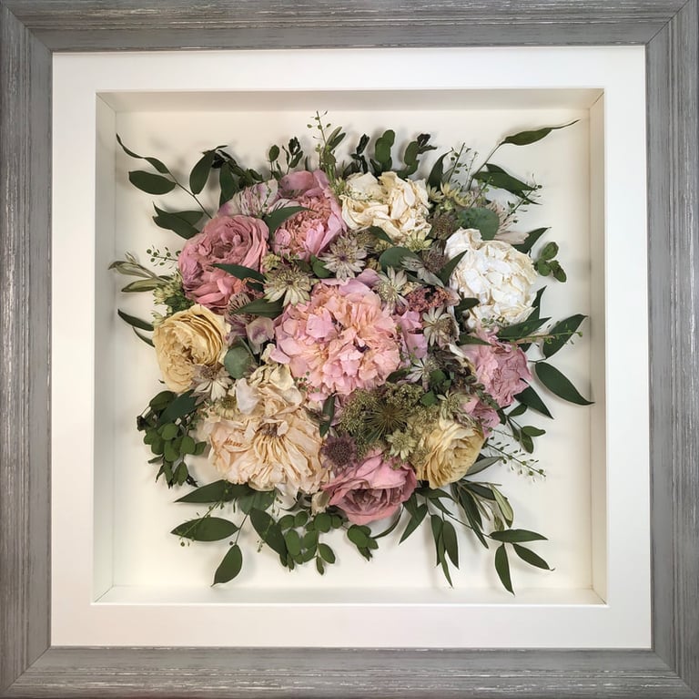 Birdseye view preserved wedding bouquet of pink peonies in a frame