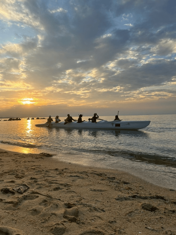 6 seater paddlers at sunset