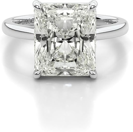 Radiant cut diamond engagement ring with a white gold band and four-prong setting.