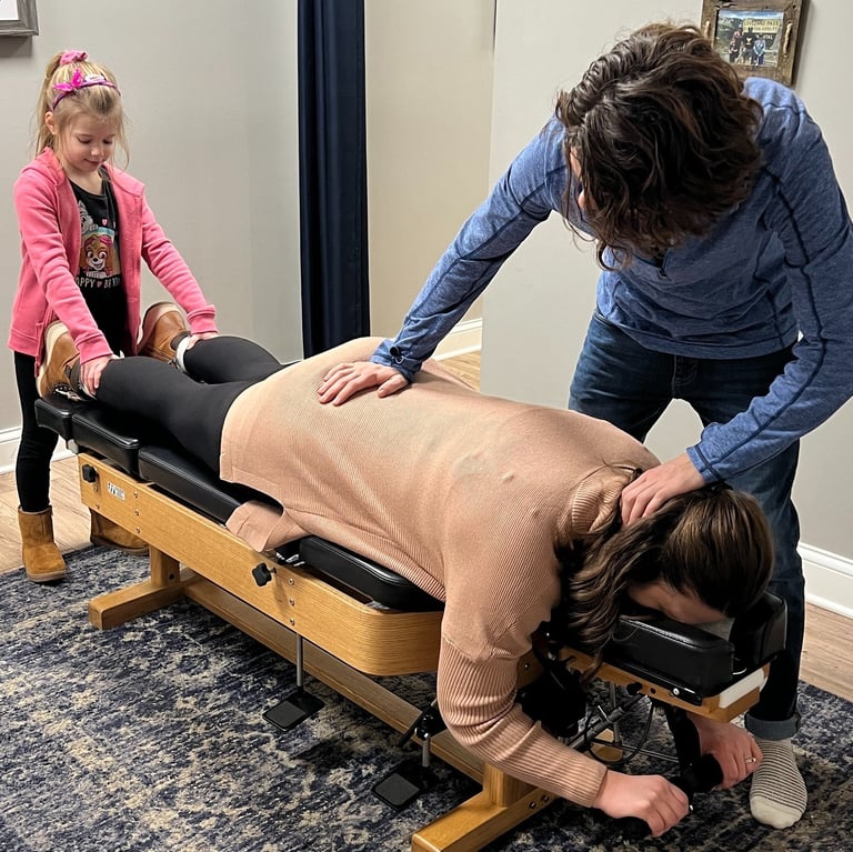 Expecting mom getting adjusted to reduce sciatica and prepare for birth