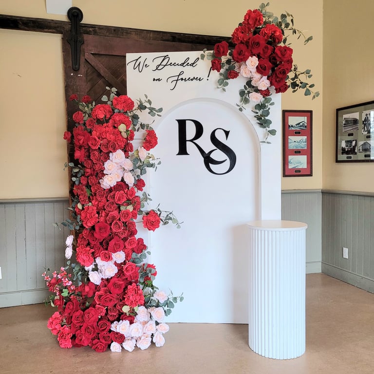 Red floral arrangement with custom made initials with red floral arrangements