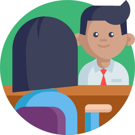 a man in a suit and tie is sitting at a desk